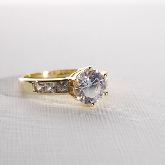 Simulated White Diamond Ring in a Goldtone Ring Size 8 - Picture 4 of 9